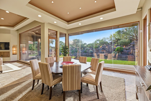 Dining room with lush garden view - Buy this luxury house in Ivins, 3 bedrooms