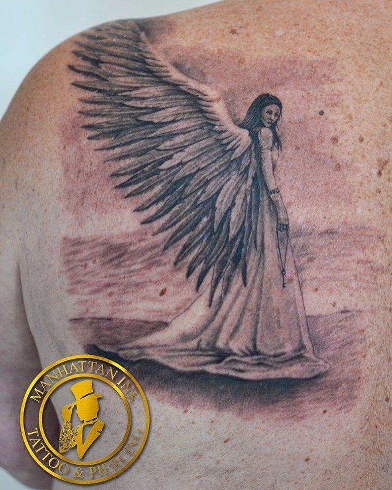 Angel With Large Wings Tattoo