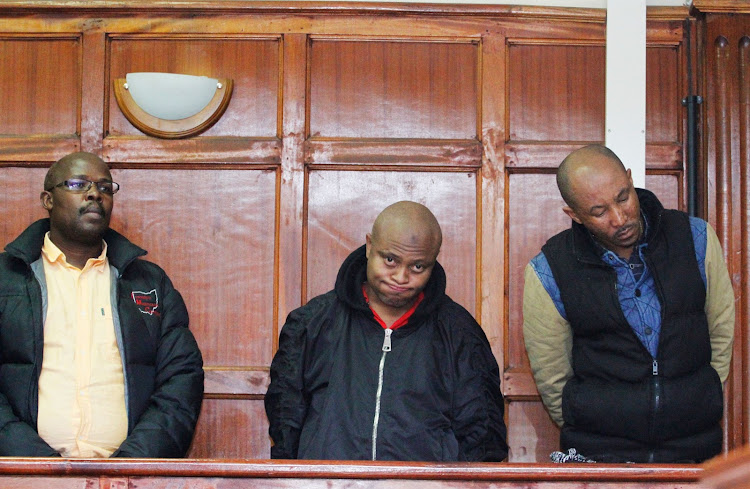 Mzava Suleman, Sharrif Haji and Titus Fedha in Nairobi magistrate's court on Tuesday August 27. Accused of pretending to be witchdoctors who could cleanse land of evil spirits.