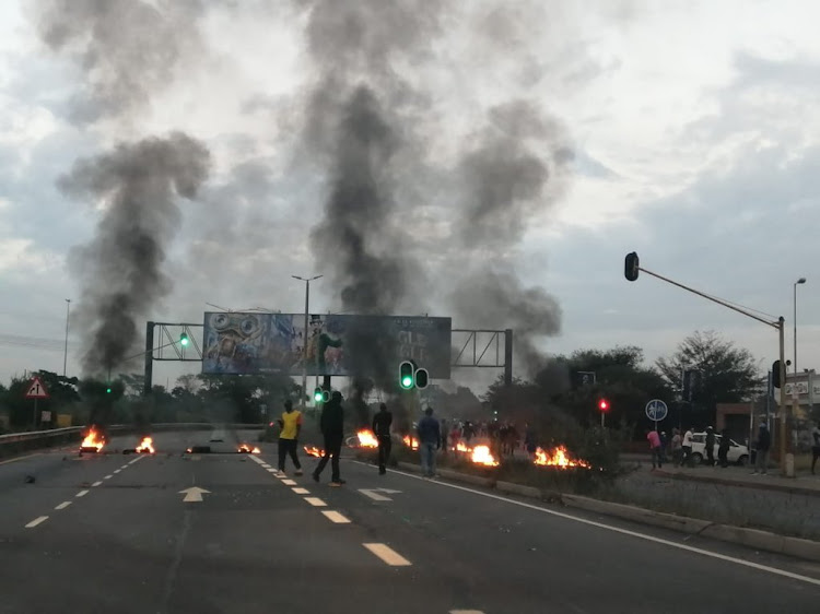 Police said about 1,000 residents blocked several roads with burning tyres and rocks at about 6am.