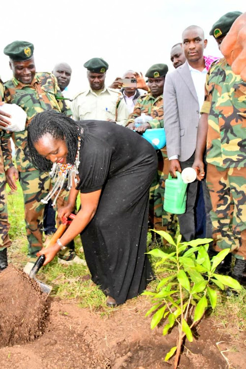 Environment CS Soipan Tuya at a tree planting exercise at Osinoni Secondary School, in Transmara West Sub County, Narok County on Wednesday January 4, 2023