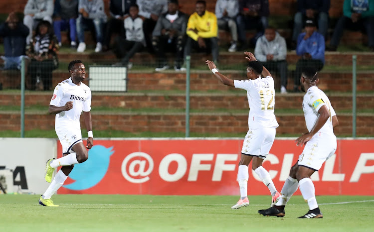 Bidvest Wits' defender Bongani Khumalo (L) celebrates with teammates after scoring a goal during the Absa Premiership match against Supersport United at Bidvest Stadium, Johannesburg South Africa on 10 January 2018. Wits won 2-0.