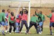 HARD WORK: Mamelodi Sundowns players during a training session at Chloorkop in Kempton Park yesterday. Pic. Veli Nhlapo. 12/08/08. © Sowetan.