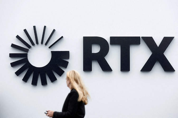 A visitor passes the Raytheon Technologies Corporation (RTX) logo at Le Bourget Airport near Paris, France, June 22 2023. Picture: BENOIT TESSIER/REUTERS