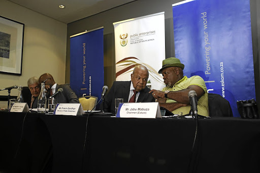 Minister of public enterprises Pravin Gordhan chats to Eskom chair Jabu Mabuza.