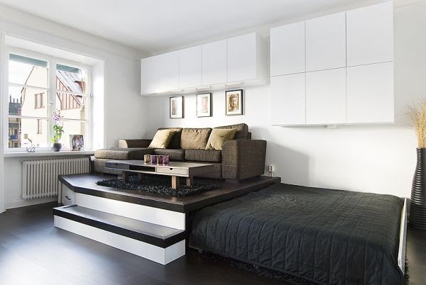 Platform slide-away beds can be used to create a living room area which means that two living areas can share the same space in a studio apartment. 