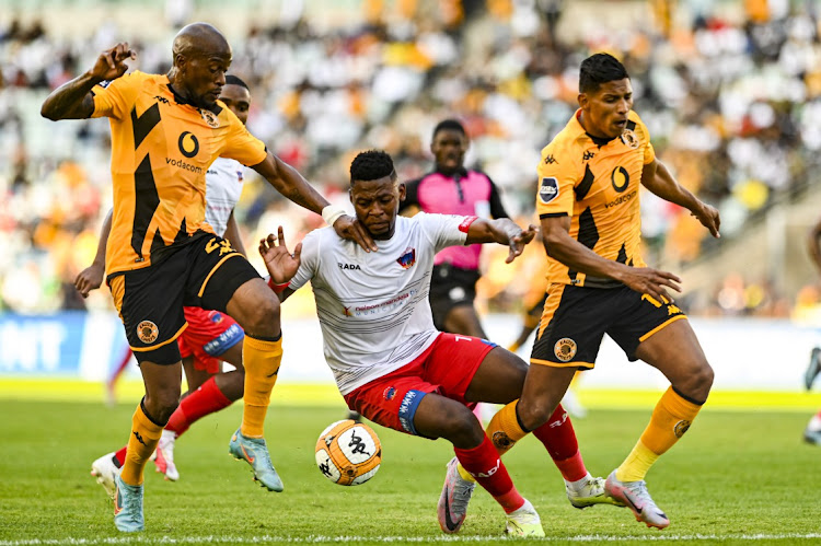 Chippa United's Andile Mbenyane is challenged by Kaizer Chiefs' Sifiso Hlanti (left) and Edson Castillo in their DStv Premiership match at Moses Mabhida Stadium in Durban on August 6 2023 in Durban.