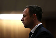 South African Paralympic athlete Oscar Pistorius reacts to the verdict  in his murder trial at the High Court in Pretoria, South Africa, 12 September 2014.  Judge Thokozile Masipa found South African Paralympic athlete Oscar Pistorius not guilty of the murder of Reeva Steenkamp in February 2013 but guilty of culpable homicide.  EPA/ALON SKUY / POOL