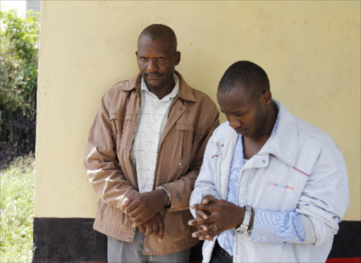 SWOOP: Isaack Ngula and Dickson Ndirangu, who were arrested with AP uniforms and are suspected to have been posing AP officers while robbing citizens at Huruma police station yesterday. Photo/Monicah Mwangi