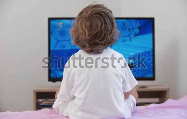 A boy watches TV.