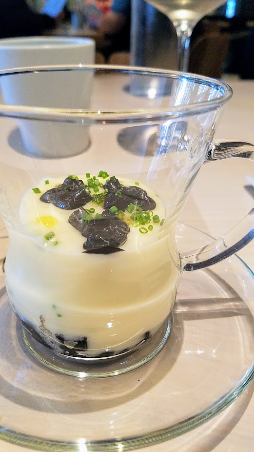 A Meal at In Situ, a restaurant at SF MOMA offering iconic dishes: this is Cuttlefish Cappuccino with potato, braised cuttlefish, ink by Massamiliano Alajmo, Le Calandre from Rubano, Italy, 1996