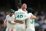 Captain Faf du Plessis and Dwaine Pretorius celebrate the wicket of England captain Joe Root.