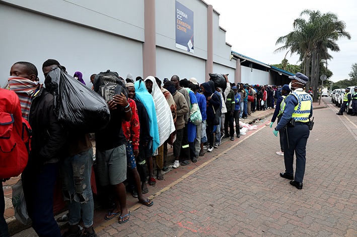 Durban's homeless queue for medical testing at the Durban Exhibition Centre.