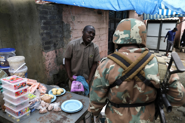 SANDF soldiers patrol Alexandra to enforce SA's 21-day lockdown, March 31 2020. Picture: ALON SKUY