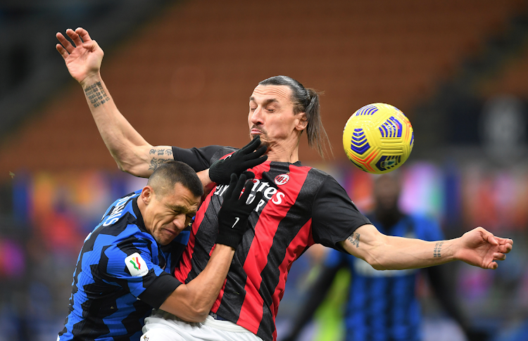 Inter Milan's Alexis Sanchez in action with AC Milan's Zlatan Ibrahimovic