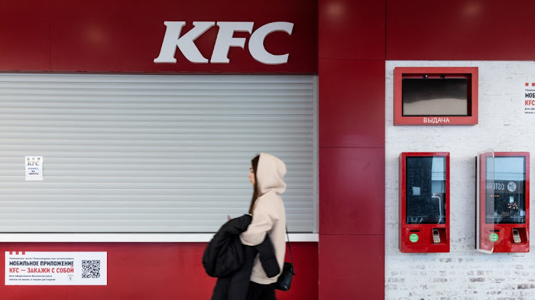 A woman walks past a closed KFC restaurant in a shopping mall in Moscow, Russia on March 21 2022. Picture: REUTERS/MAXIM SHEMETOV