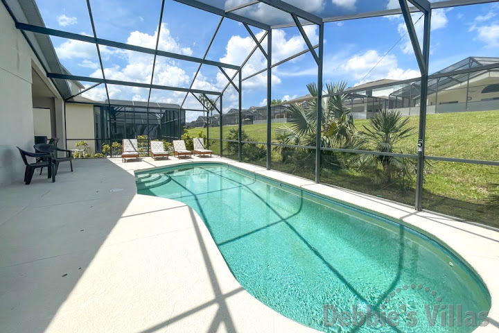 Sun-drenched private pool deck at this Davenport vacation villa