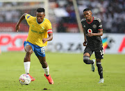 Themba Zwane of Mamelodi Sundowns and Monnapule Saleng of Orlando Pirates during the DStv Premiership match at Loftus Versfeld Stadium in December.