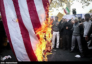 Iranian people burn the US flag as they mark the anniversary of the seizure of the US Embassy, in Tehran, Iran, on November 4 2018. 