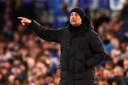 Manchester City manager Josep Guardiola gestures during the Premier League match against Everton at Goodison Park.