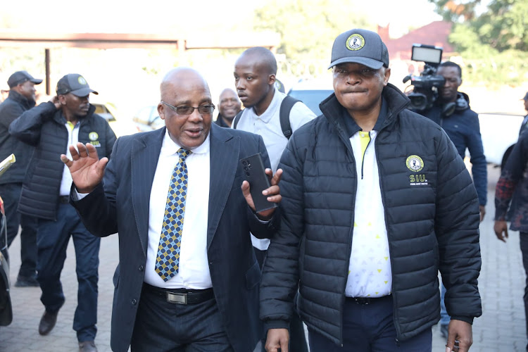 Home affairs minister Aaron Motsoaledi joined an SIU team during a raid at Pretoria’s Desmond Tutu Refugee Centre on Friday.