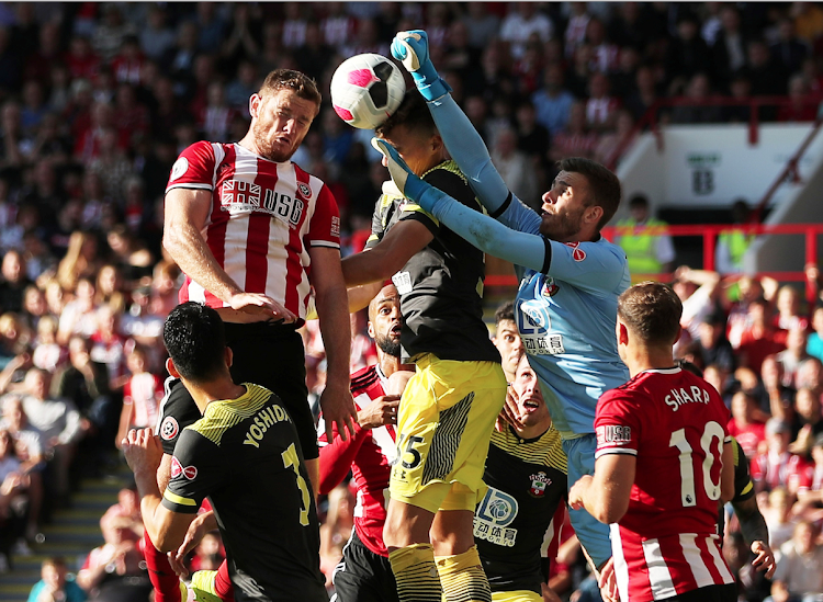 Sheffield United's Jack O'Connell in action with Southampton's Jan Bednarek and Angus Gunn