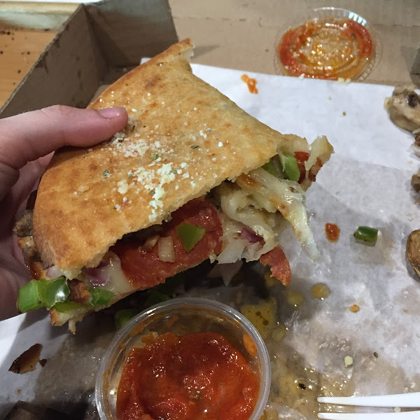 Calzone on folded pizza crust. A bit weird but it tasted good