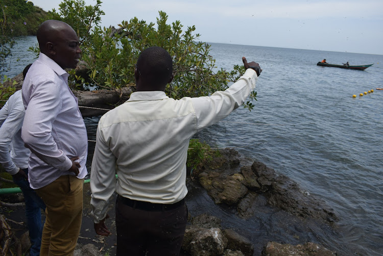 MP Caroli Omondi and Yamaha Motors Company Ltd marketing assistant officer Anthony Muhia near Lake Victoria at Uterere beach in Suba South on March 20,2024