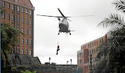 Helicopters rescued guests and staff members from the flooded  Centurion Lake Hotel yesterday.