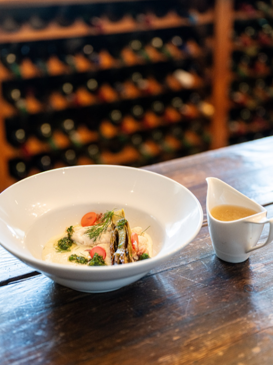 Reddy's poached fish, roasted fennel, fennel panna cotta, pickled radish, chimichurri and fish broth starter.