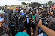 President Cyril Ramaphosa engages with the media after laying a wreath at the grave of the late former ANC president Zaccheus Mahabane in Maokeng, Free State. 