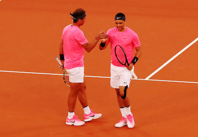 Rafael Nadal and Trevor Noah during their doubles match against Roger Federer and Bill Gates at Cape Town Stadium on February 7 2020.