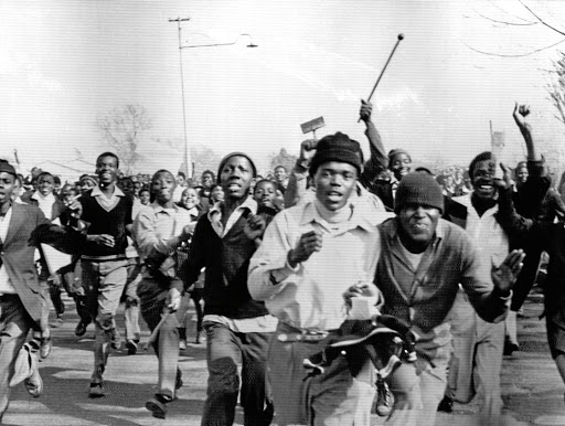 Black students protesting against the compulsory teaching of Afrikaans in black schools charge during the 1976 Soweto uprisings. / Bettmann Archive