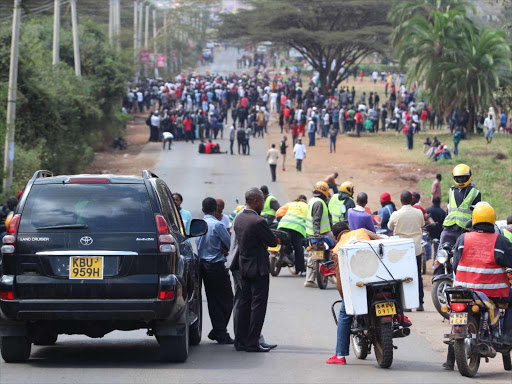 Stuck motorists following the MMU flow of motorist along the Magadi road following Multimedia University student Protest on September 27,2016. PHOTO/ENOS TECHE.