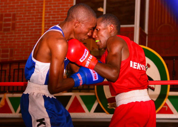 Joseph Kamau of Police (L) battles with Muranga's Dalmas Kyalo during a recent National Novices Boxing Championships