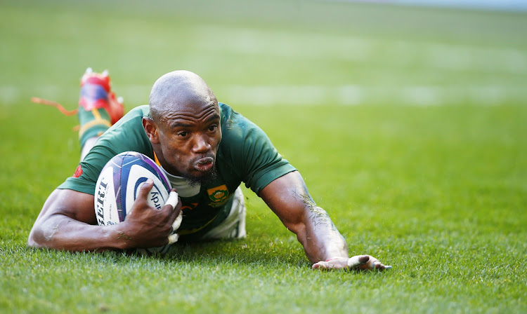 The Springboks' Makazole Mapimpi goes over for a try in the outgoing tour Test against Scotland at Murrayfield in Edinburgh on November 13 2021.