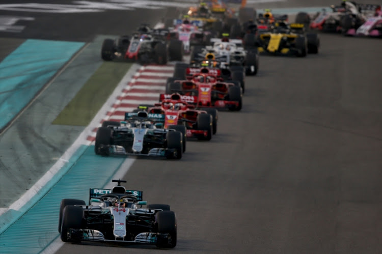 Lewis Hamilton of Great Britain driving the (44) Mercedes AMG Petronas F1 Team Mercedes WO9 leads the field at the start during the Abu Dhabi Formula One Grand Prix at Yas Marina Circuit on November 25, 2018 in Abu Dhabi, United Arab Emirates.