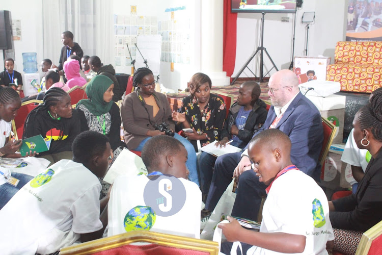 The Vice Chair of the UN Committee on the Rights of the Child, Philip Jaffe` interacting with children during the inaugural Africa Children Summit in Nairobi on April 11, 2023.