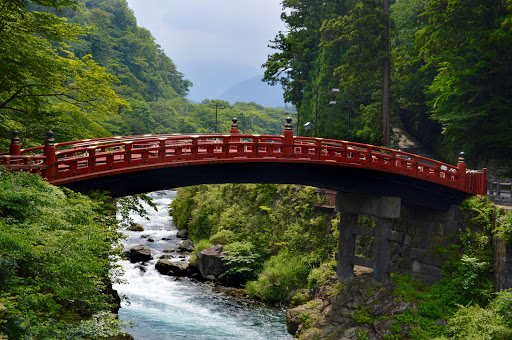 japan-red-bridge.jpg - A scenic bridge linking temples and gardens.