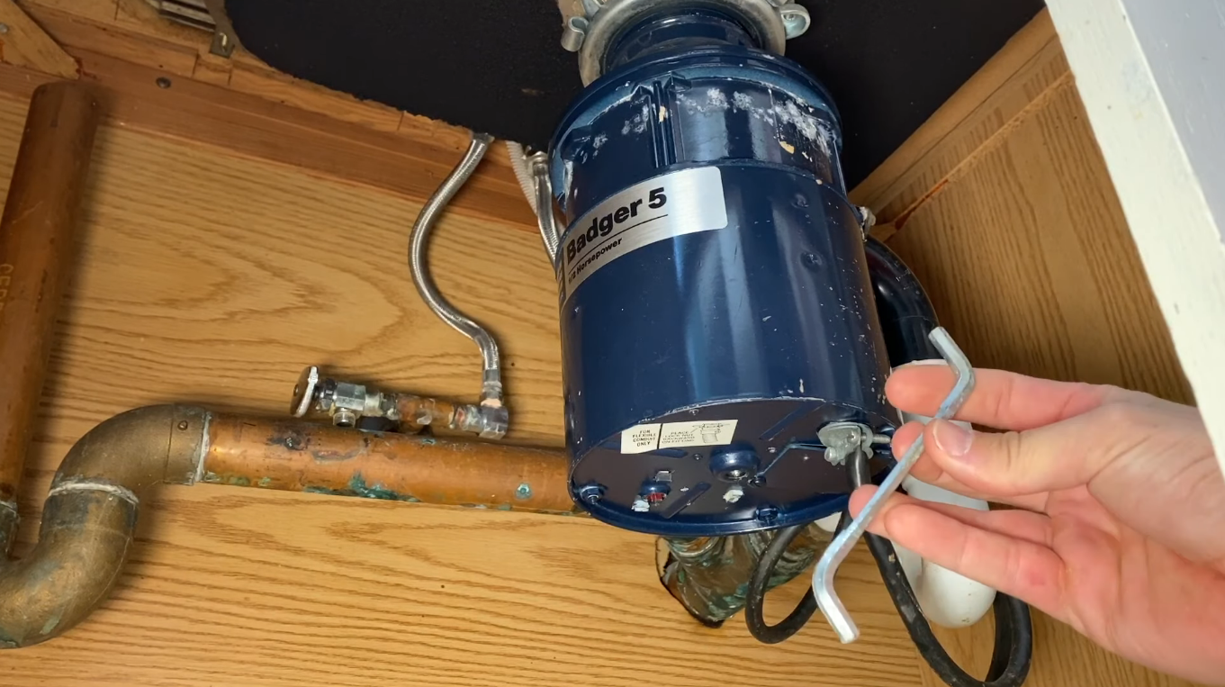 How to Repair or Replace a Garbage Disposal: Steps, Cost & More