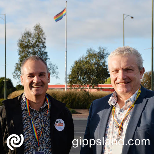 Wellington Shire Council Mayor Ian Bye and chief executive David Morcom at the Raglan Street roundabout in Sale, where the rainbow flag was flown to support IDAHOBIT