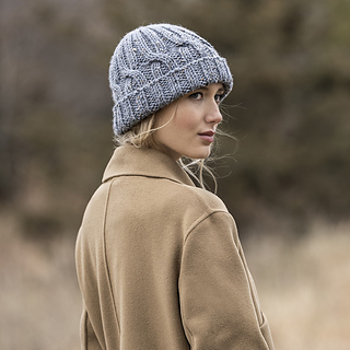 woman wearing a gray cable knit hat with a turned up brim