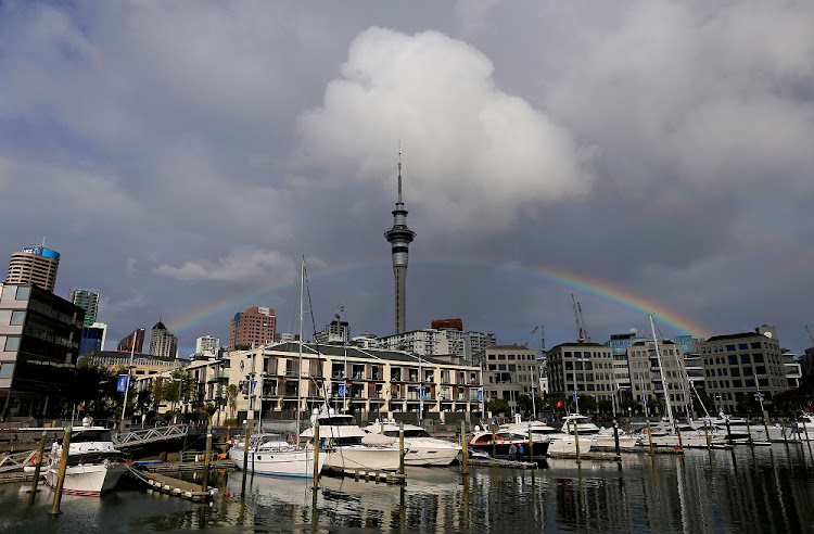 A rainbow appears on the Auckland skyline featuring Sky Tower in New Zealand. Auckland will go into a seven-day lockdown on Sunday after a new local case of the coronavirus of unknown origin emerged.