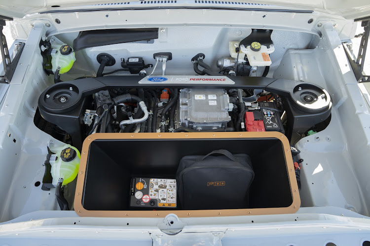 The neat and green electric motor stuffed into the 1978 F-100 truck.