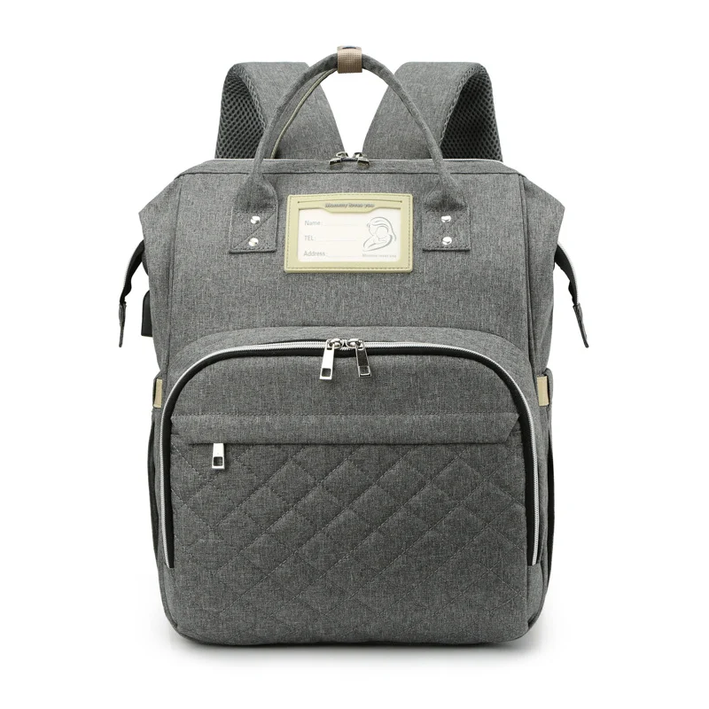 Opvouwbare luiertas met grote capaciteit en inklapbaar bed, perfect voor moeders en baby's, praktisch en ruim.
