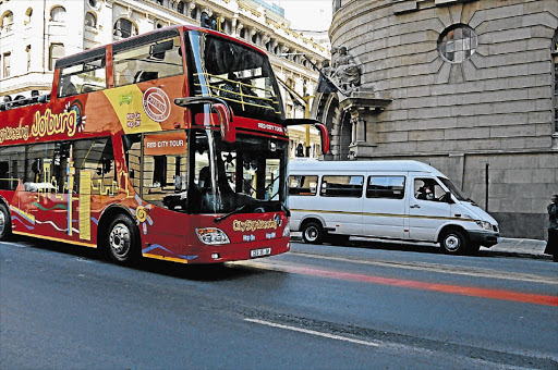 ON YOUR LEFT: The famous red tourist bus