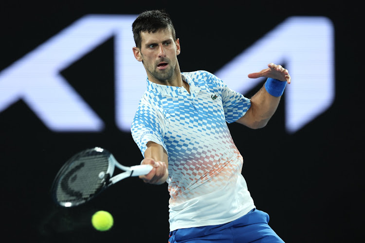 Novak Djokovic of Serbia plays a forehand during his fourth-round match against Alex de Minaur of Australia on day eight of the 2023 Australian Open at Melbourne Park on January 23 2023.