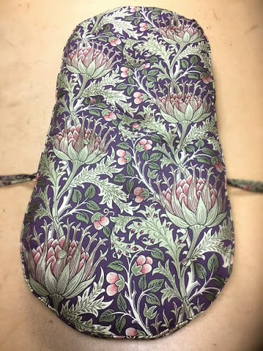 Lesley has re-upholstered a conservatory chair cushion in this traditional very popular Artichoke fabric by William Morris from Sanderson Fabrics and Wallpapers.
