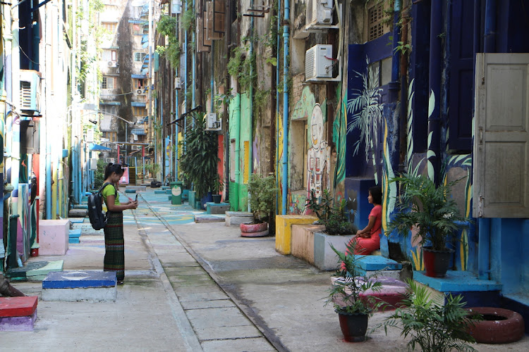 Visitors taking pictures in downtown Yangon, Myanmar. File photo: THIN LEI WIN/REUTERS