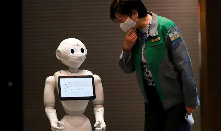 Engineers have developed a robot that can detect whether people are wearing a mask to guard against Covid-19.